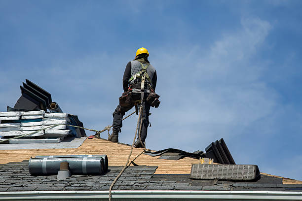 Professional Roofing technician working in Arlington, CO
